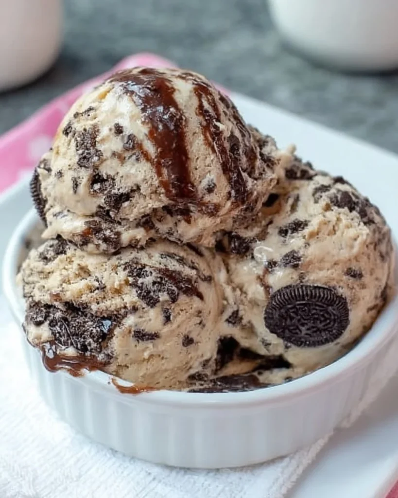 Delicious Oreo fudge cappuccino ice cream with cookies and hot fudge swirls