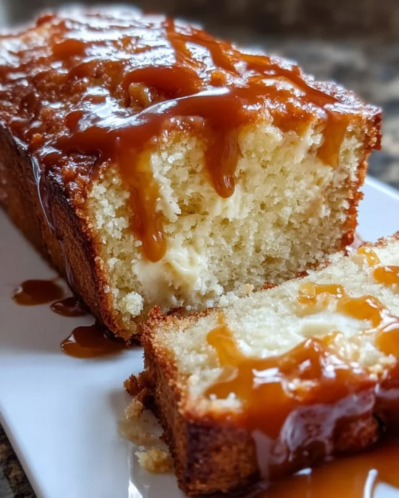 Delicious slice of Caramel Cream Cheese Bread with a creamy topping.