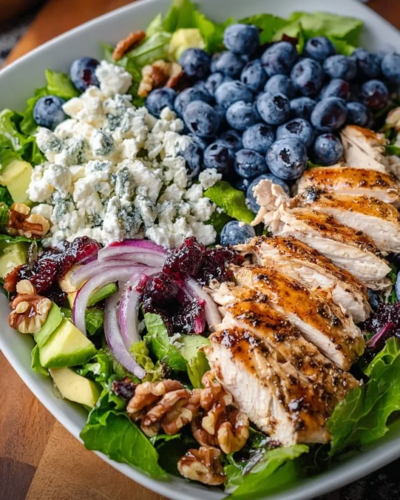 A vibrant Chicken Blueberry Feta Salad with fresh ingredients and a colorful presentation