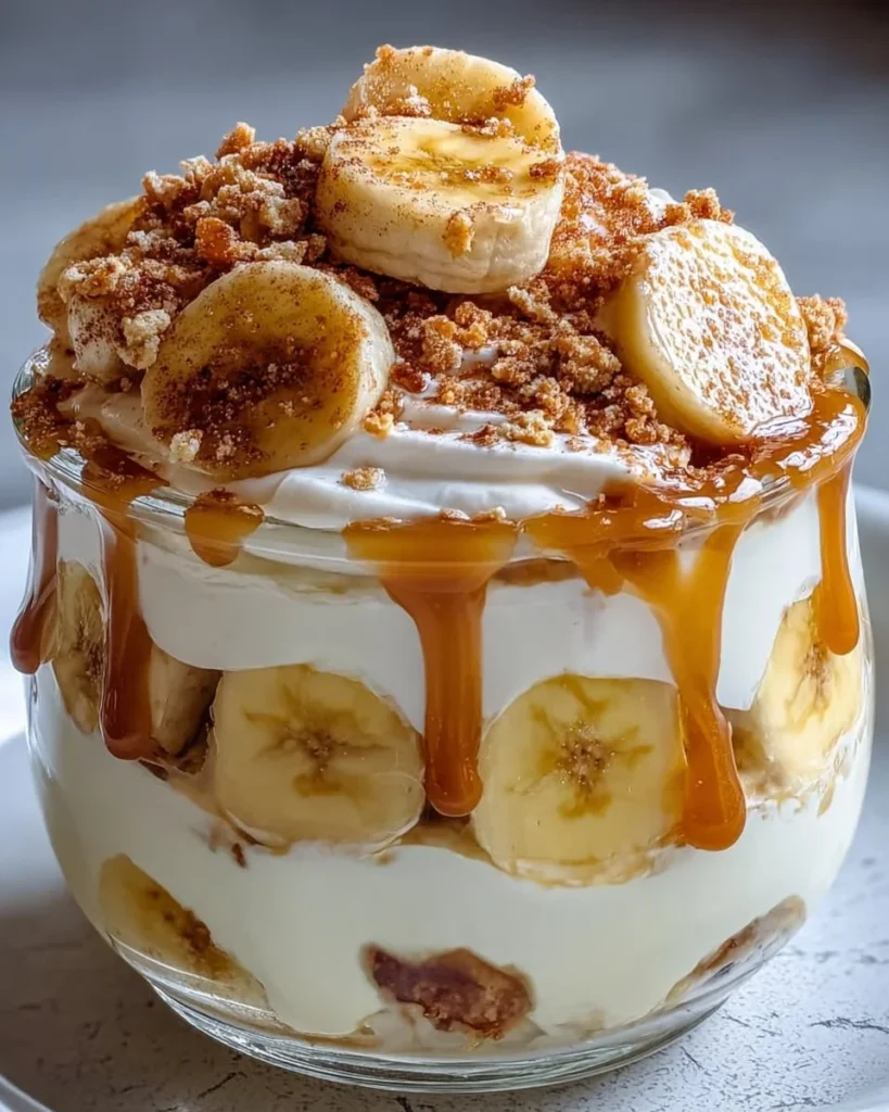 Delicious Protein Banana Pudding topped with fresh banana slices and nuts