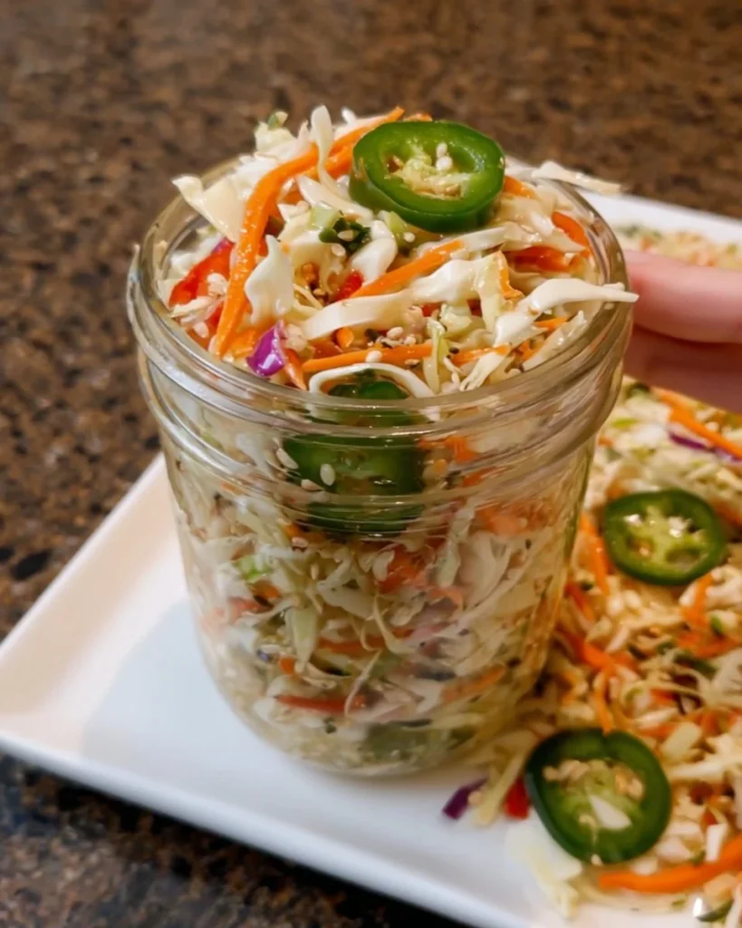 Fresh and colorful Spicy Slaw served in a bowl with vibrant vegetables