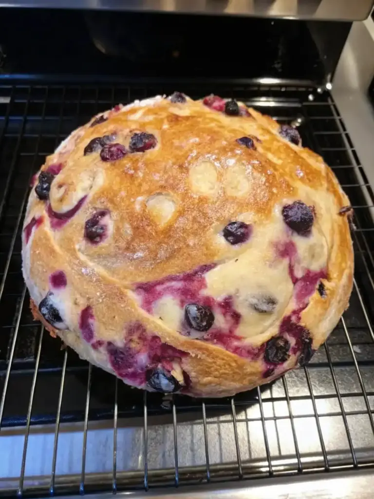 Blueberry Lemon Cream Cheese Sourdough Bread served with a slice cut out