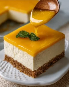 Delicious no bake mango cheesecake topped with fresh mango slices