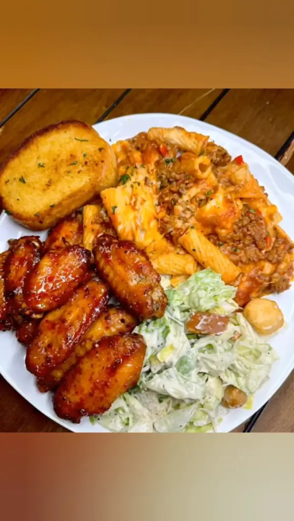 Plate of Baked Ziti with Chicken Wings showcasing a delicious Italian-American dish