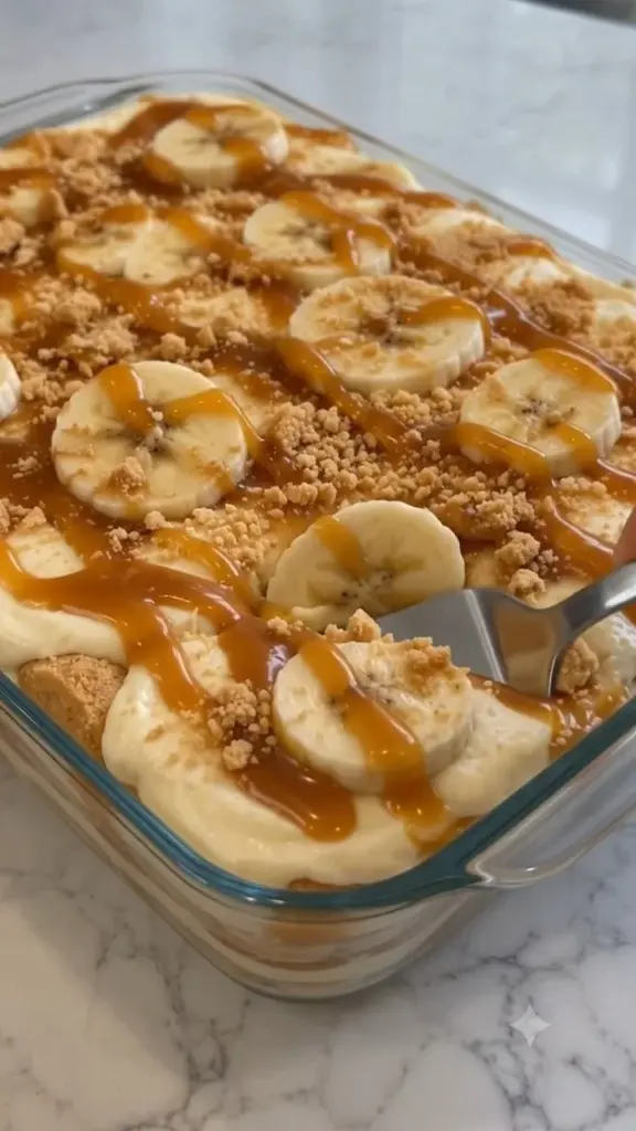 Delicious Banana Pudding Tiramisu with Caramel served in a glass dish.