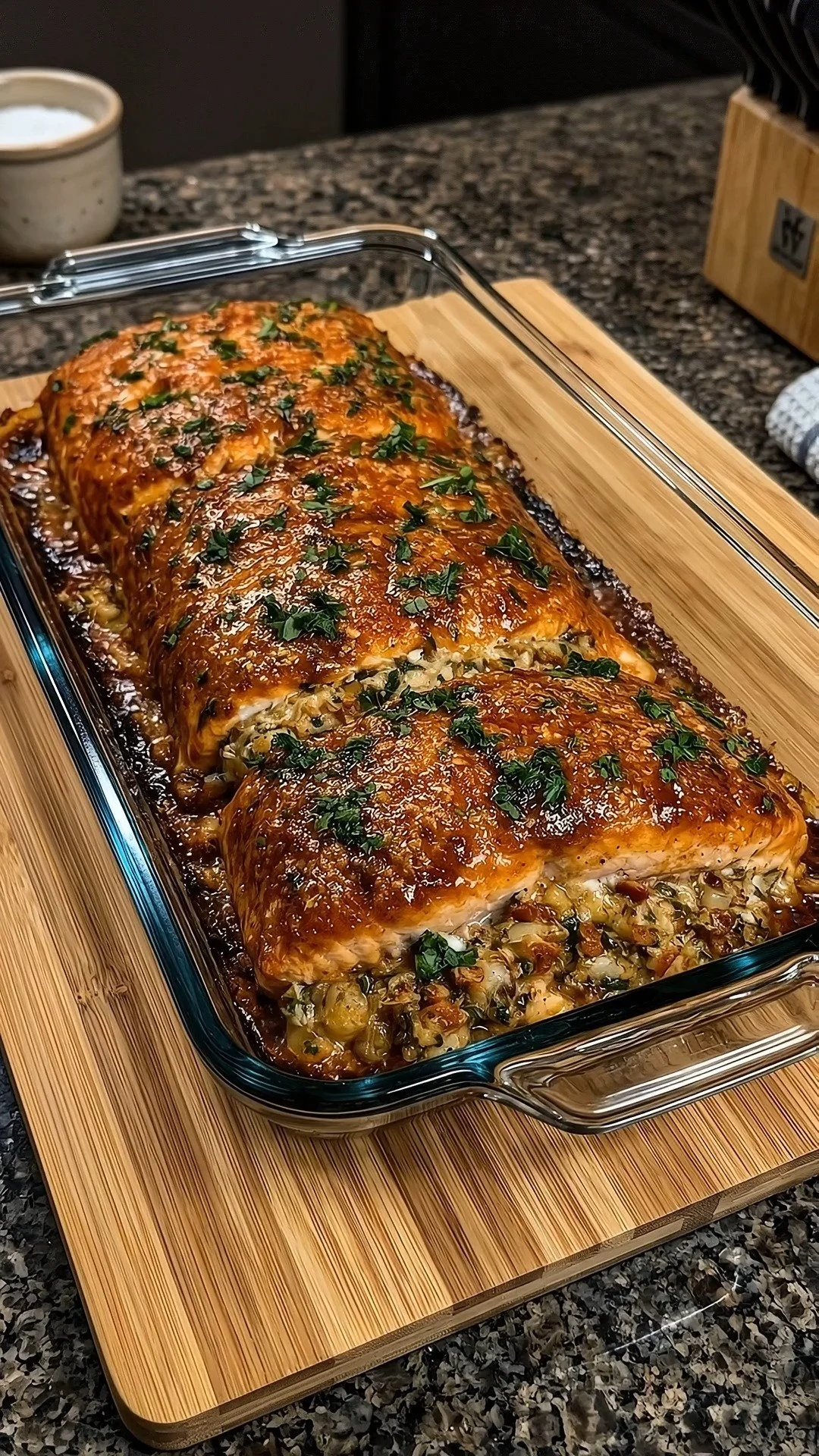 Brown Sugar Bourbon Stuffed Salmon served on a plate with garnishes.