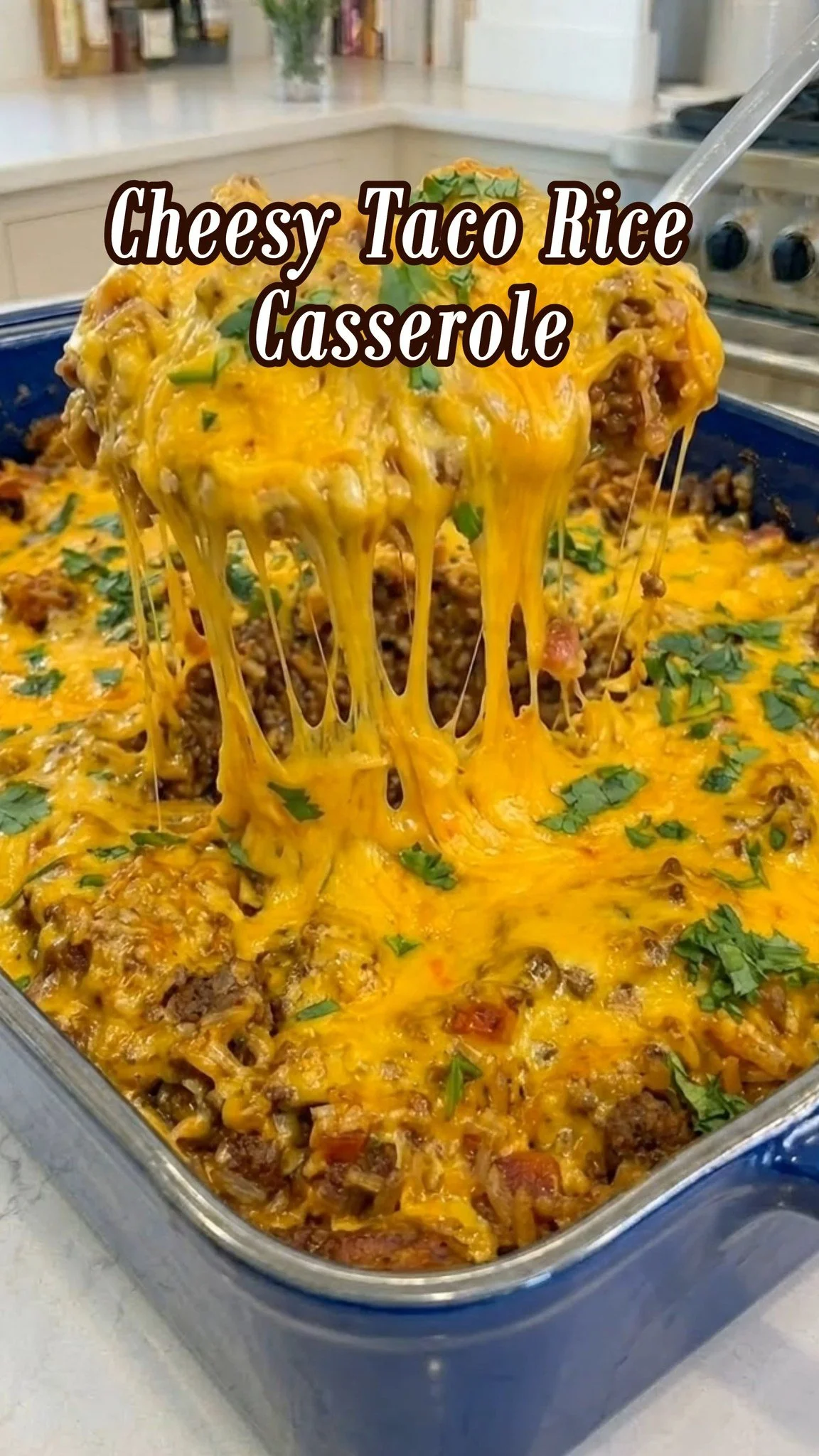 Cheesy Taco Rice Casserole baked in a dish topped with cheese and herbs