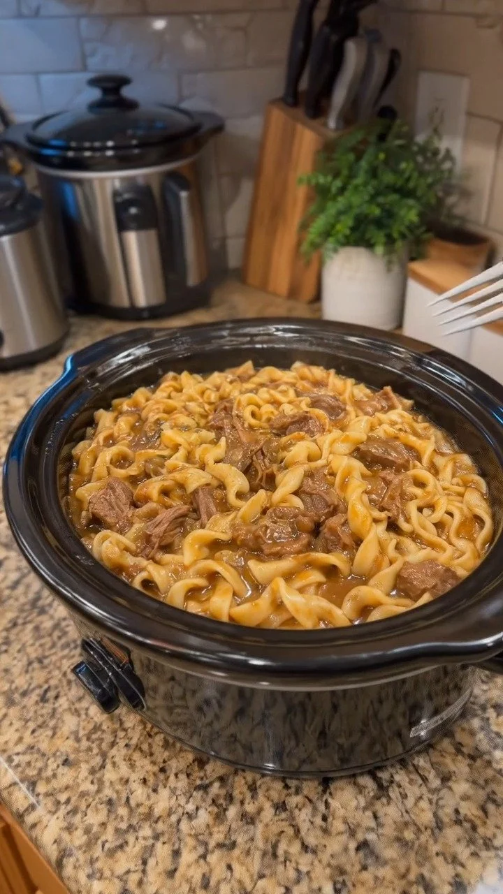 Crockpot Beef and Noodles dish served in a bowl with garnishes