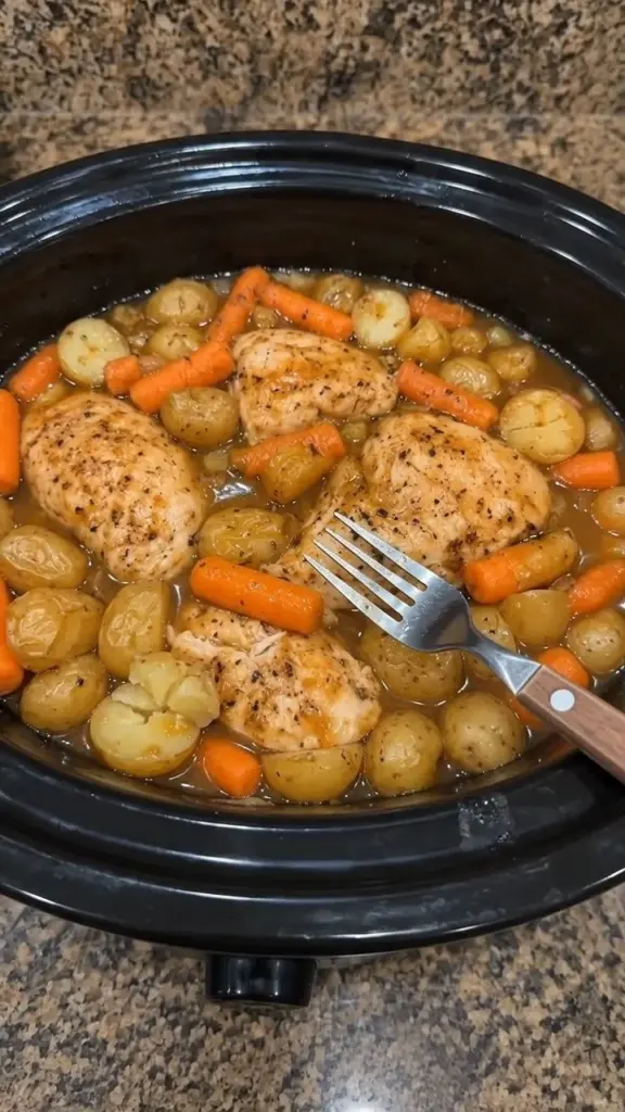 Crockpot Honey Ranch Chicken served with baby carrots and buttery potatoes