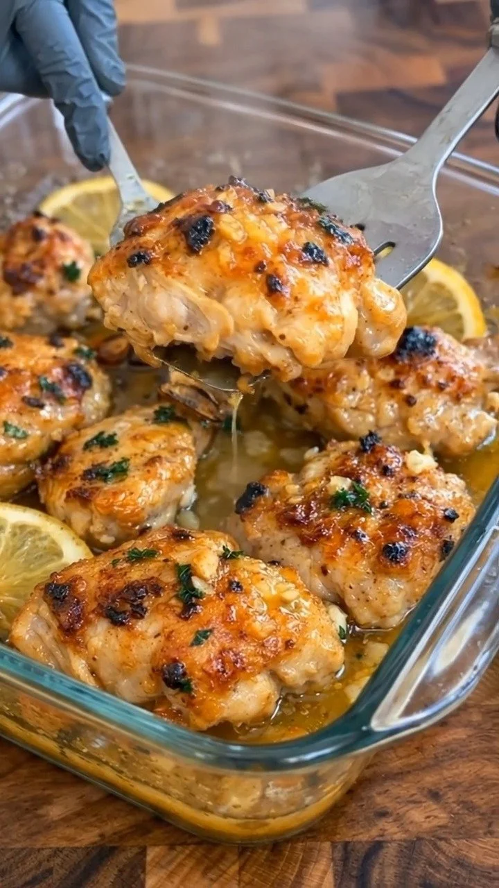 Lemon Garlic Chicken served on a plate with herbs and spices