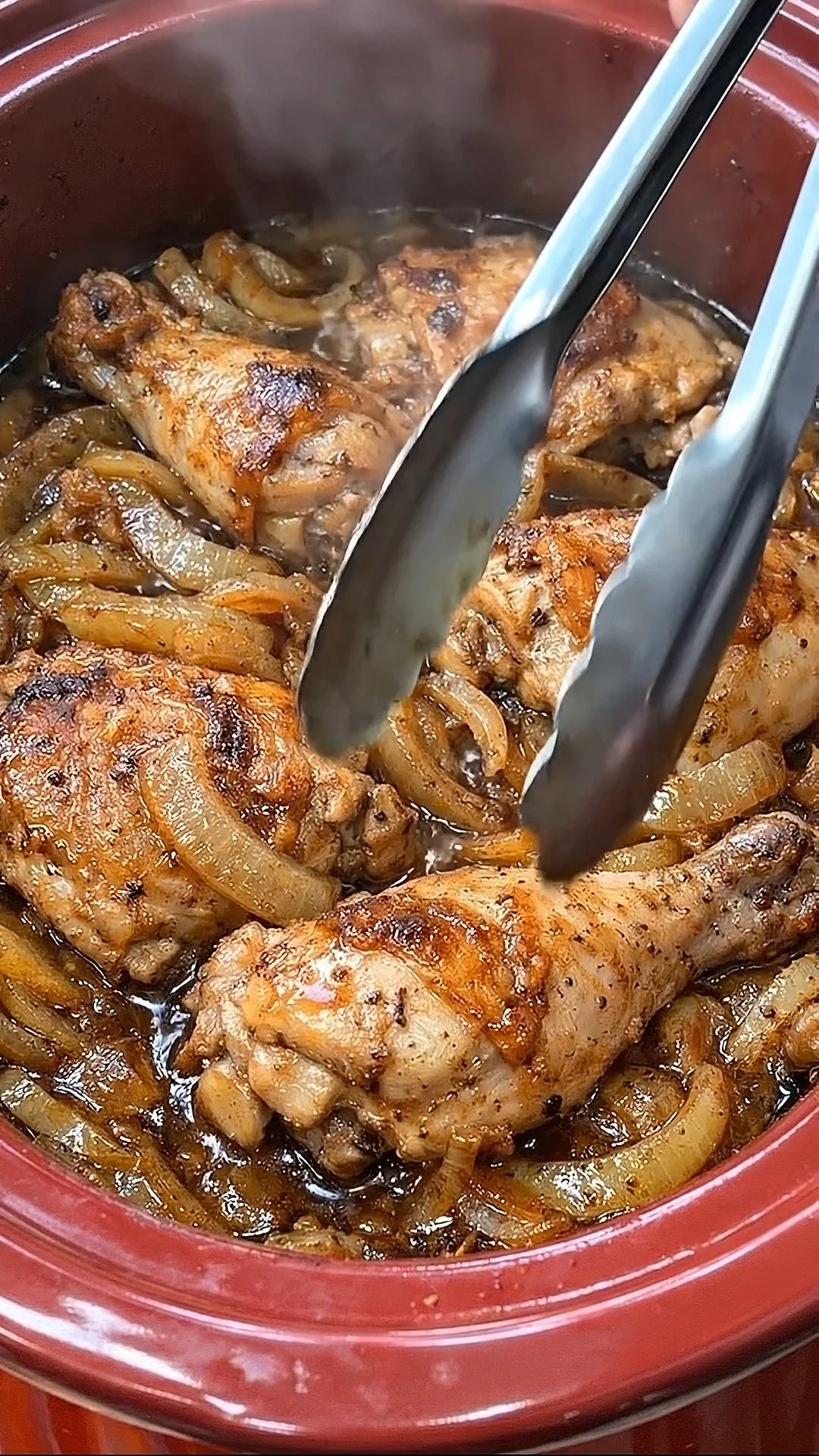 Slow Cooker Caramelized Onion Chicken served on a plate with herbs