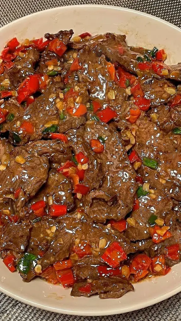 Delicious spicy garlic beef stir-fry served with colorful vegetables