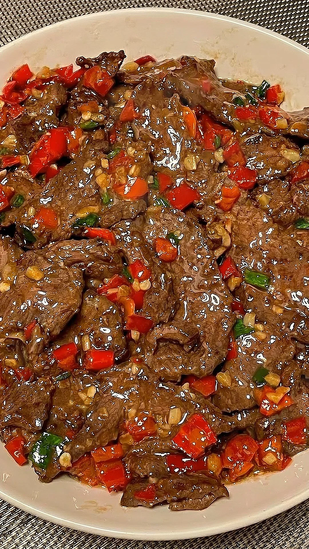 Delicious spicy garlic beef stir-fry served with colorful vegetables