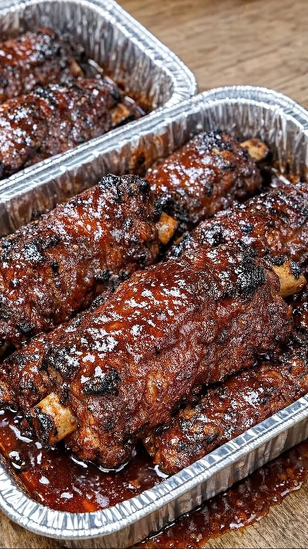 Sticky BBQ beef short ribs served on a platter with a savory glaze.