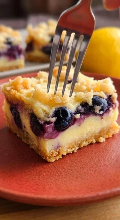 Delicious Sugar-Free Blueberry Lemon Pie Bars topped with fresh blueberries and lemon zest.