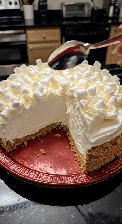 Sugar-free marshmallow whip cheesecake topped with whipped cream and berries
