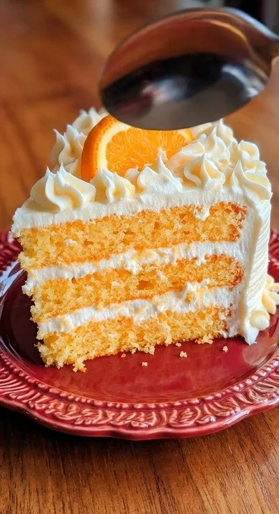 Sugar-Free Orange Creamsicle Cake with vibrant orange frosting