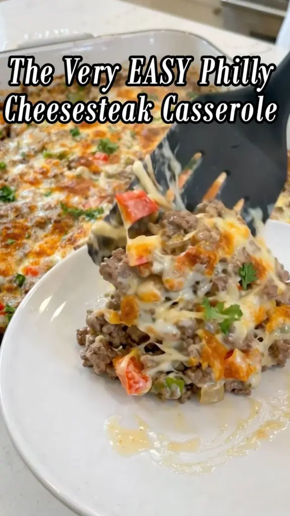 Easy Philly cheesesteak casserole with cheese, beef, and peppers.